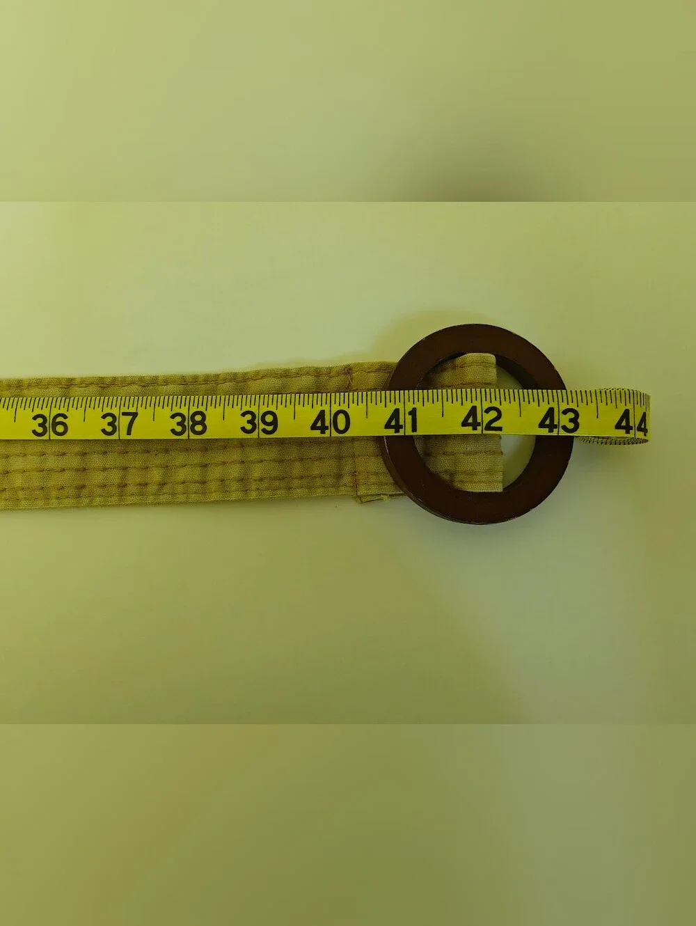 beige canvas stripe boho Y2K belt features dark brown round wooden buckle
